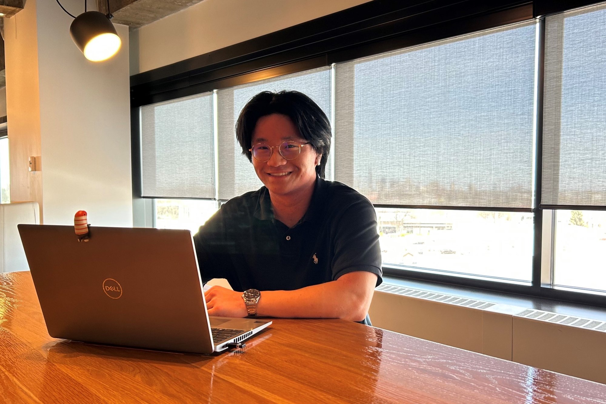 Adam Nguyen Working at Table Zoomed